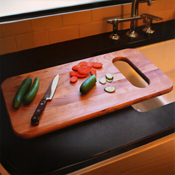 Catskill Craftsmen 24'' Reversible Deluxe Over-the-Sink Cutting Board with Wide Mouth Slot, Flat Grain, Oiled Finish, Single Board, In Use View