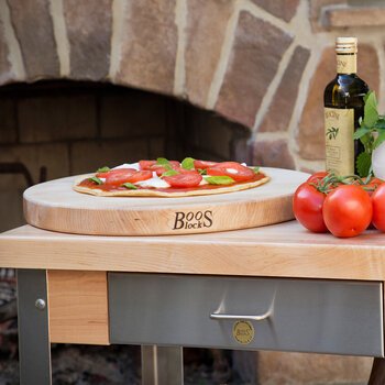 John Boos Pizza Lover Basket Gift Pack, 7-Piece with R18 Northern Hard Rock Maple Cutting Board, In Use Illustration